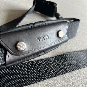 TUMI Strap- Black
Removable shoulder pad 
Adjustable up to 45” inches